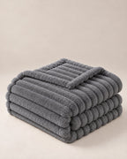 Plaid polaire côtelé Douillette, coloris gris anthracite, plié