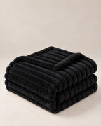 Plaid polaire côtelé Douillette, coloris noir, plié