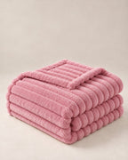 Plaid polaire côtelé Douillette, coloris rose poudré, plié