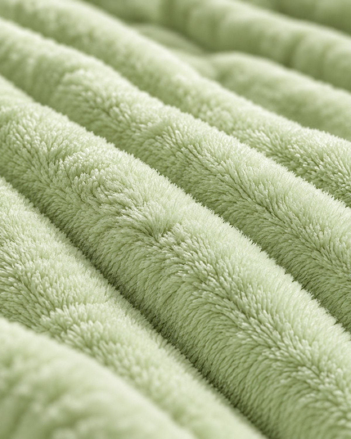 Plaid polaire côtelé Douillette, coloris vert sauge, gros plan sur la maille côtelée
